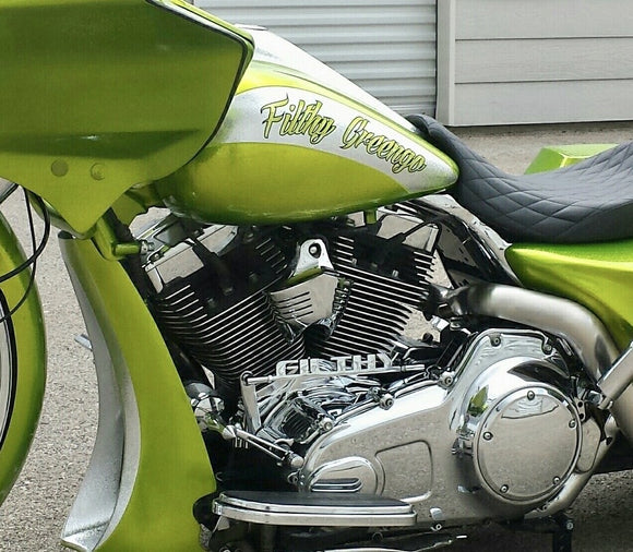 “Filthy” shift linkage on a green motorcycle. 