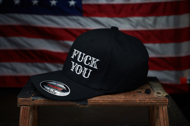 Frontside of black hat with the words Fuck You 
