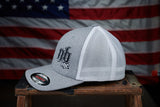 Side view of the Nasty Bagger Trucker Hat with an American Flag backdrop.