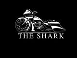 Logo with a motorcycle and the word “Shark” underneath it. 